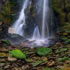 Ireland-Ferriters Cove Close-up of waterfall and mossy rocks Art Print